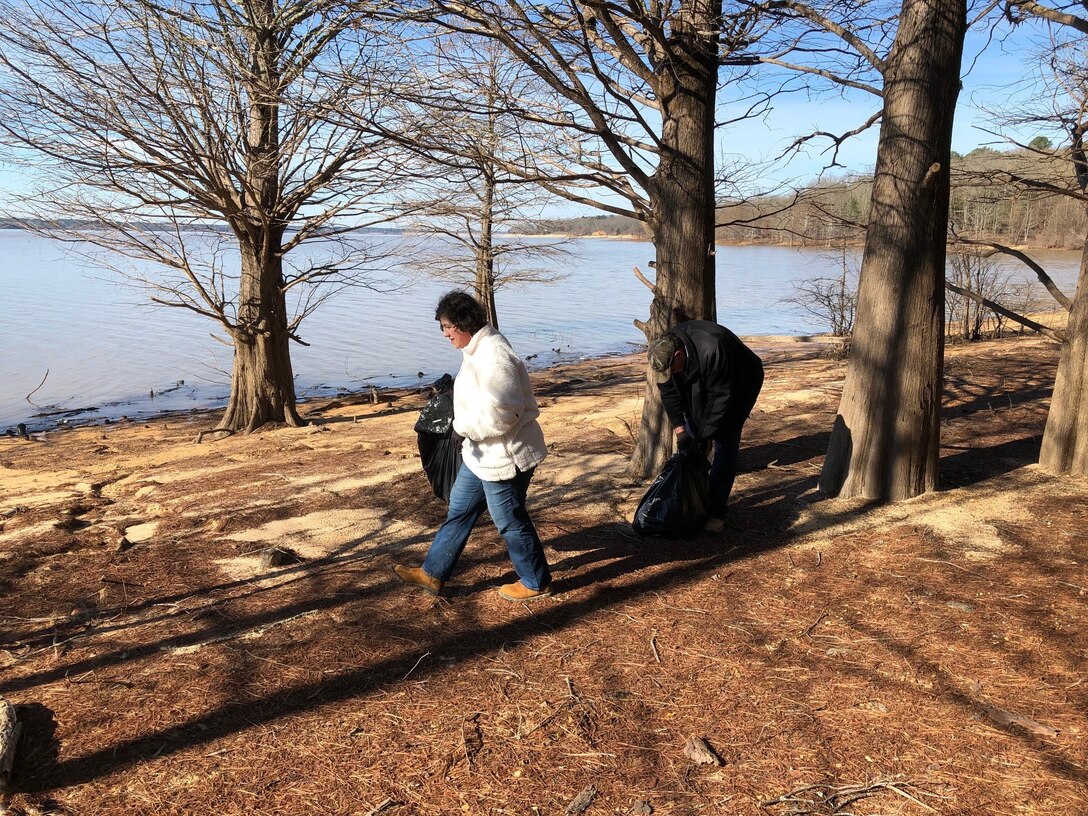 Volunteers pick up trash on Enid Lake's shoreline at the lake's annual Cleanup Day event Feb. 22. 

U.S. Army Corps of Engineers (USACE) Vicksburg District park rangers, natural resources specialists and 95 volunteers removed 40 cubic yards of compacted trash and 31 tires from the lake's roads and shorelines during the event, which provides the community near the lake with the opportunity to help maintain its beauty.