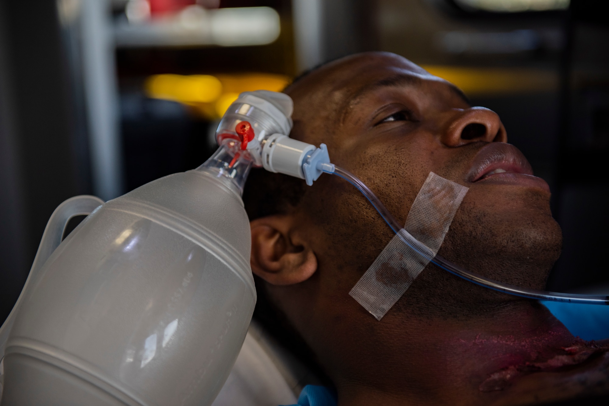 Staff Sgt. Zachary Collins, 325th Operational Medical Readiness Squadron Ambulance Services Department technician, participates in a medical emergency exercise as a simulated patient at Tyndall Air Force Base, Florida, March 12, 2020. A joint medical exercise was conducted and included the 325th Medical Group, Bay County Emergency Medical Services and Ascension Sacred Heart Bay Medical Center. (U.S. Air Force photo by Staff Sgt. Magen M. Reeves)