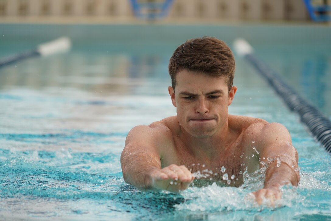 Staff Sgt. Norman Sharpe, 747th Communications Squadron, runs in the swimming pool during the Toughest Warrior Competition on Joint Base Pearl Harbor-Hickam, Hawaii, March 9, 2020. The week-long event, comprised of six-person teams from various commands, includes physical, critical thinking, and team-building challenges held at different locations throughout the installation. (U.S. Air Force photo by Staff Sgt. Nicholas Brown)