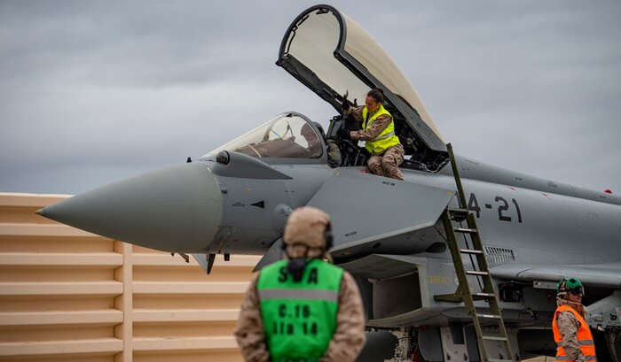 Airman assist pilot before takeoff.