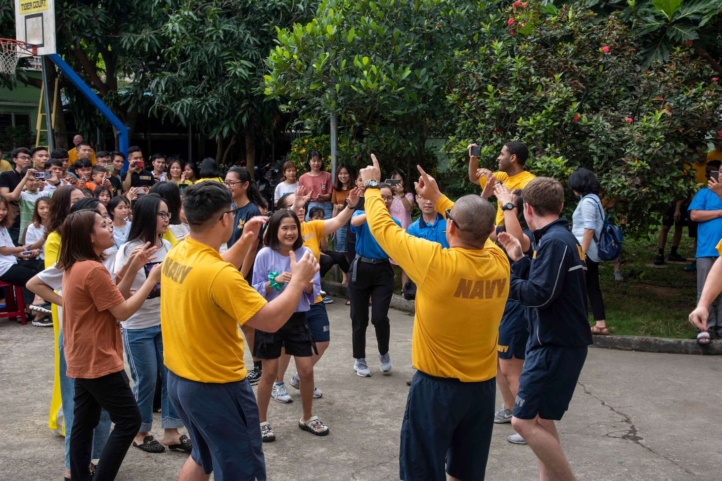 200306-N-MQ442-1063 Vietnam (March 6, 2020) U.S. Navy Sailors assigned to the aircraft carrier USS Theodore Roosevelt (CVN 71) dance with children at the Dorothea’s Project Legacies Charity Center, Da Nang, Vietnam, during a community relations project March 6, 2020. Theodore Roosevelt and the Ticonderoga-class guided-missile cruiser USS Bunker Hill (CG 52) are in Vietnam for a port visit during their scheduled deployment to the Indo-Pacific.