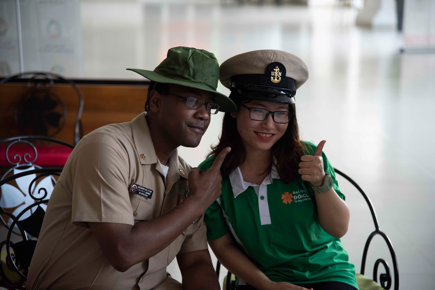 200307-N-RQ987-1131 VIETNAM (March 7, 2020) U.S. Navy Senior Chief Aviation Boatswain’s Mate Livel Clark poses for a photo with a student during a community relations project at Dong University, Da Nang, Vietnam, March 7, 2020. Theodore Roosevelt is on a scheduled deployment to the Indo-Pacific and is visiting Da Nang to commemorate the 25th anniversary of U.S. – Vietnam diplomatic relations.