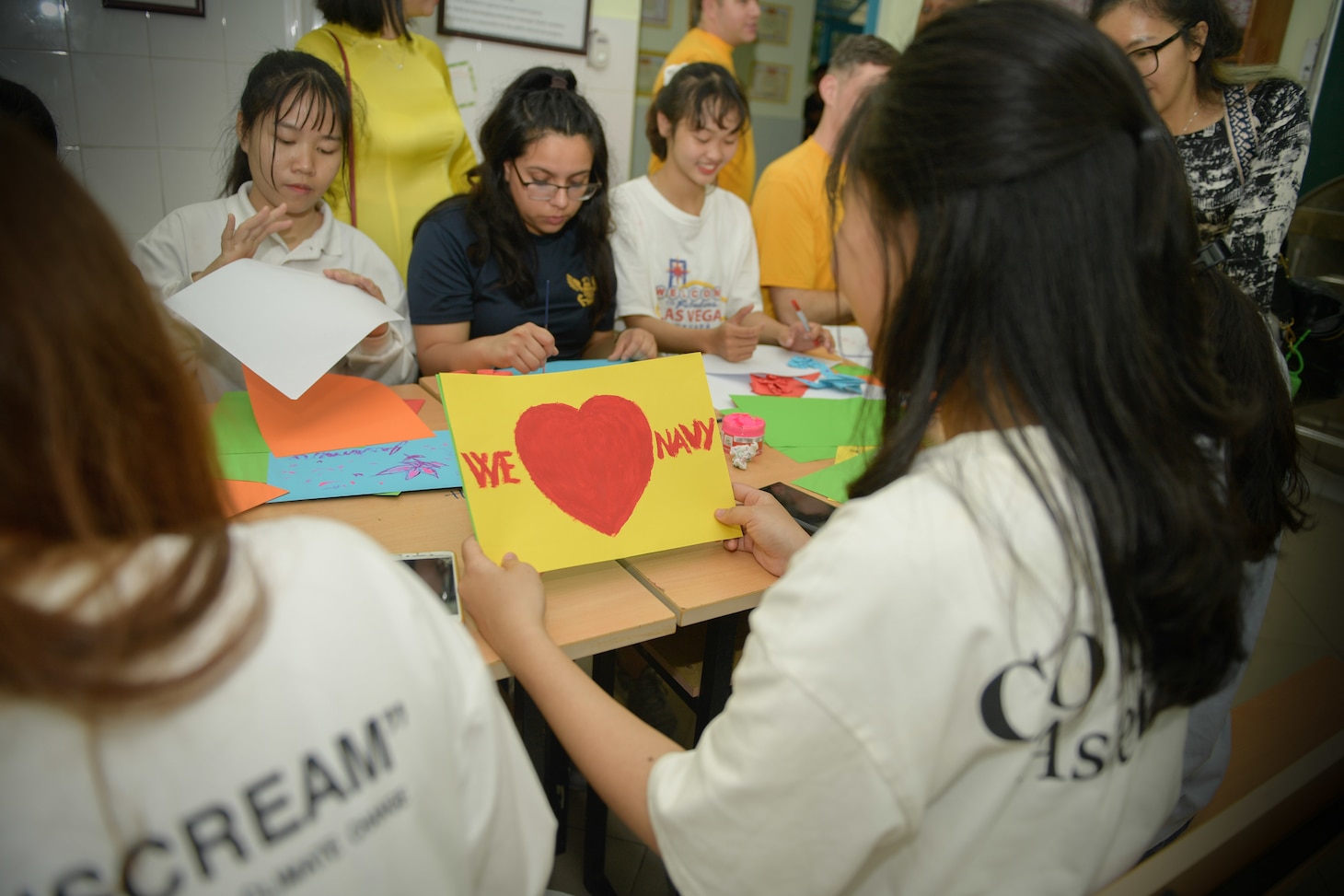 200306-N-YQ383-1479 VIETNAM (March 6, 2020) U.S. Navy Sailors assigned to the aircraft carrier USS Theodore Roosevelt (CVN 71) paint with children at the Dorothea’s Project Legacies Charity Center, Da Nang, Vietnam, during a community relations project March 6, 2020. Theodore Roosevelt and the Ticonderoga-class guided-missile cruiser USS Bunker Hill (CG 52) are in Vietnam for a port visit during their scheduled deployment to the Indo-Pacific.