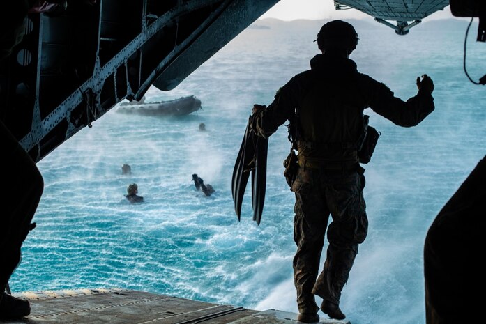 U.S. Marines with the 31st Marine Expeditionary Unit and Royal Thai Marines jump out of the back of a CH-53 Super Stallion helicopter with Marine Medium Tiltrotor Squadron (VMM) 265 (Reinforced), 31st MEU, during helocast training in Hat Yao, Kingdom of Thailand, March 5, 2020, as part of exercise Cobra Gold 2020. Exercise Cobra Gold 20, in its 39th iteration, is designed to advance regional security and ensure effective responses to regional crises by bringing together multinational forces to address shared goals and security commitments in the Indo-Pacific region. (U.S. Marine Corps photo by Cpl. Isaac Cantrell)