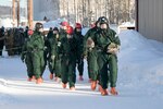 Members of a search-and-extraction team of national, state and local agencies assessed, decontaminated and prepared to treat "casualties" of a simulated helicopter crash during exercise Arctic Eagle 2020 on Fort Wainwright, Alaska, Feb. 24. The training is designed to improve interoperability while conducting sustained operations in extreme cold.