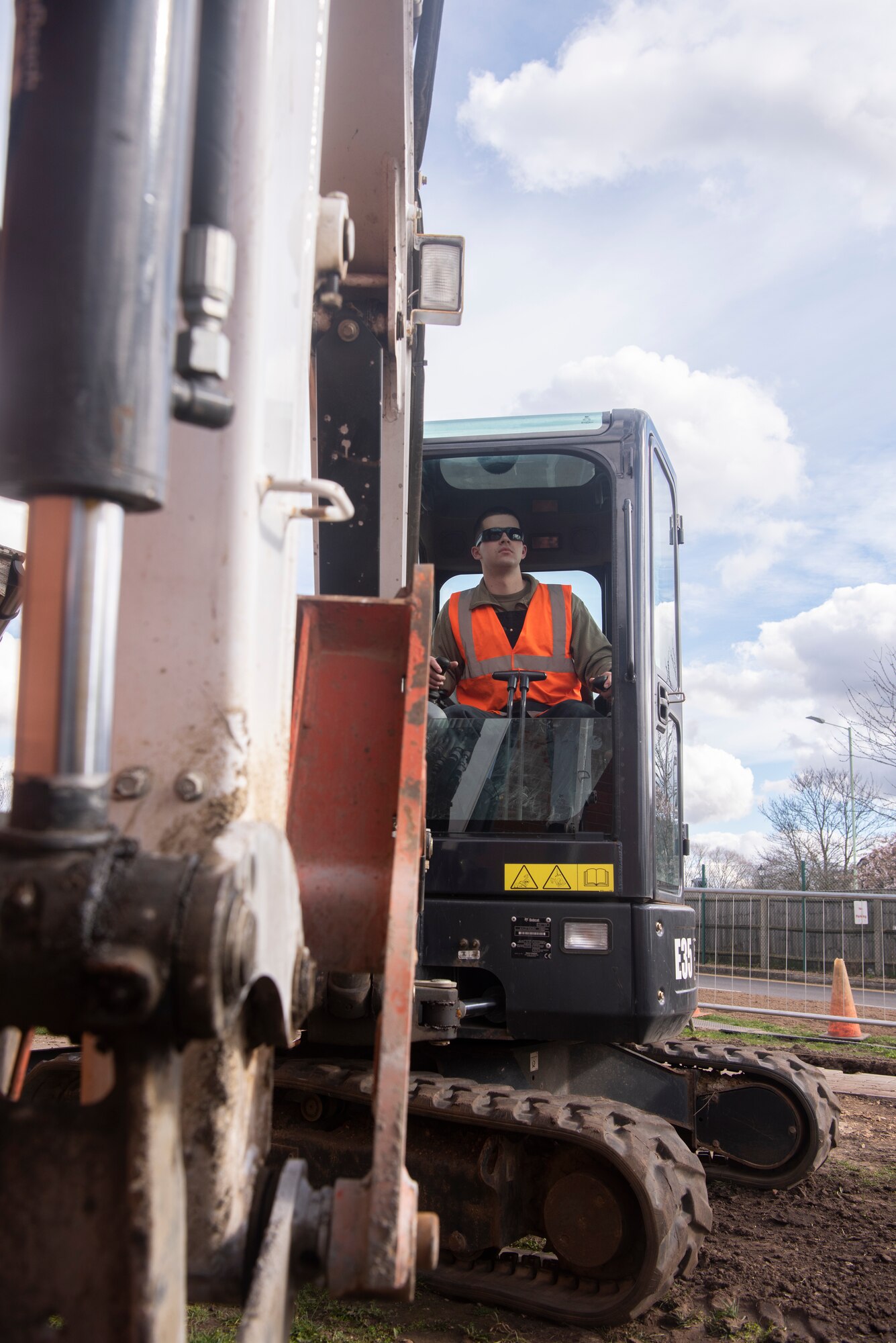 Airman 1st Class Tyler Miller, 100th Civil Engineer Squadron pavements and equipment apprentice, operates an excavator to complete a sidewalk construction project March 11, 2020, at RAF Mildenhall, England. Referred to as “Dirt Boyz”, pavements and construction equipment Airmen utilize a variety of vehicles and handheld tools to maintain the base infrastructure. (U.S. Air Force photo by Airman 1st Class Joseph Barron)