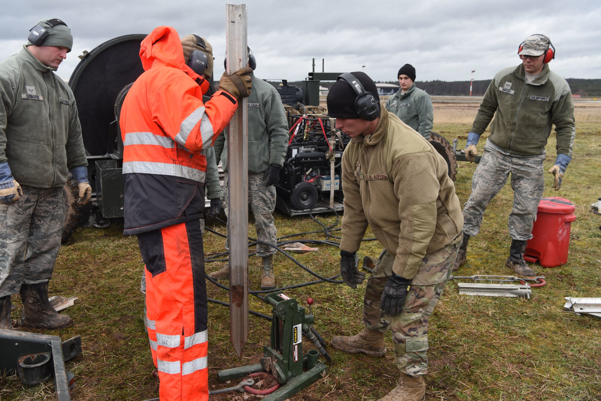 U.S. Air Force Airmen use a hydraulic tool to remove stakes from the ground during a mobile aircraft arresting system training course at Ramstein Air Base, Germany, March 11, 2020. Airmen learned how far apart to plant their stakes in order to keep the arresting system foundation secured. The training taught Airmen how to effectively build and use mobile aircraft arresting systems, which are used to rapidly decrease the speed of aircraft as they land.