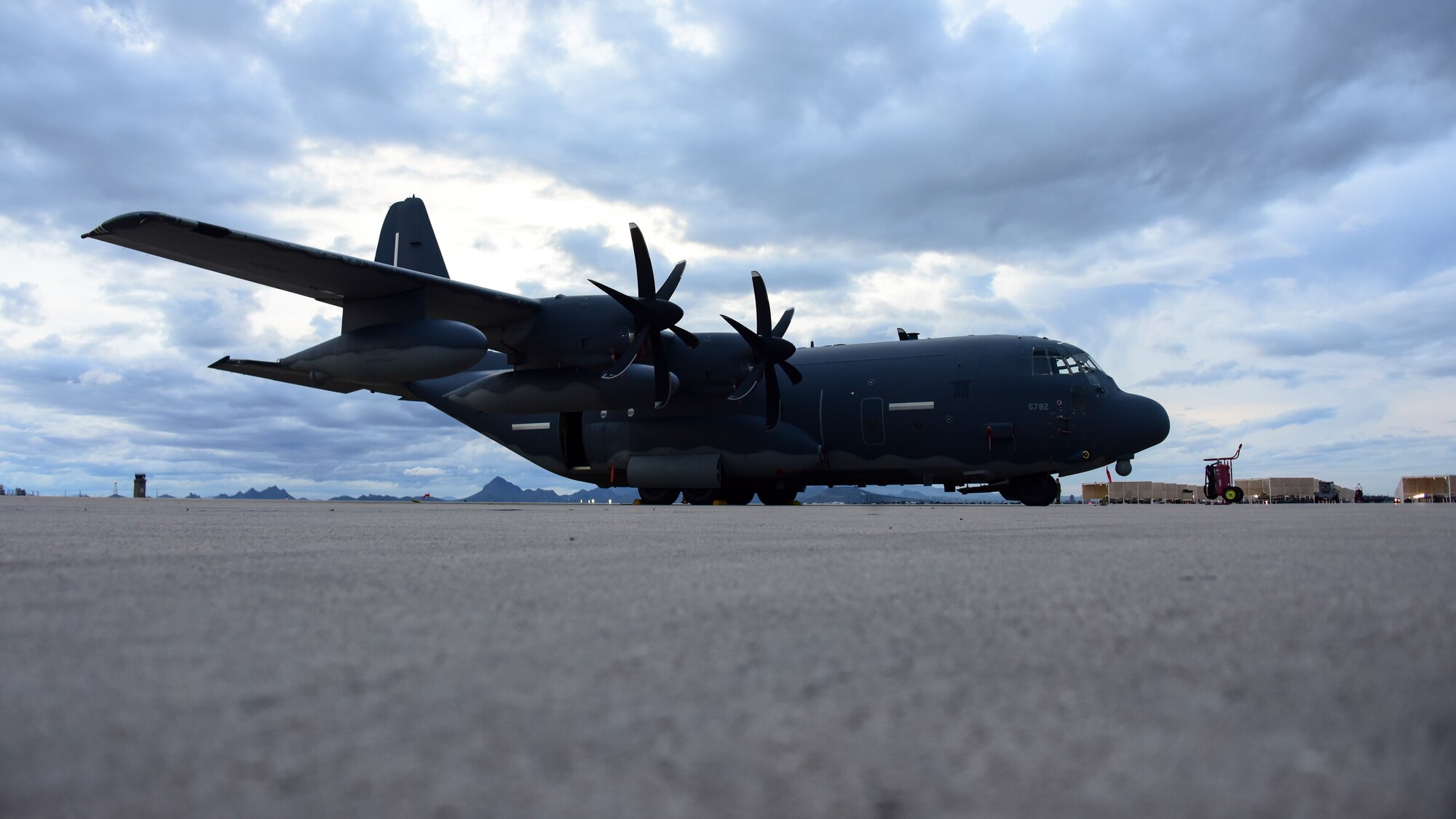 A photo of an HC-130J sitting on the flight line
