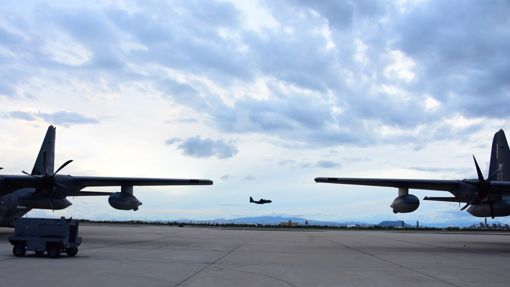 A photo of an HC-130J taking off