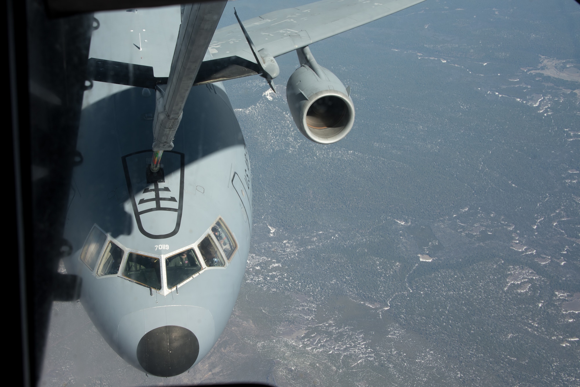 The boom of a KC-10 Extender flown by the 6th Air Refueling Squadron makes contact with a KC-10 flown by the 60th Operations Support Squadron