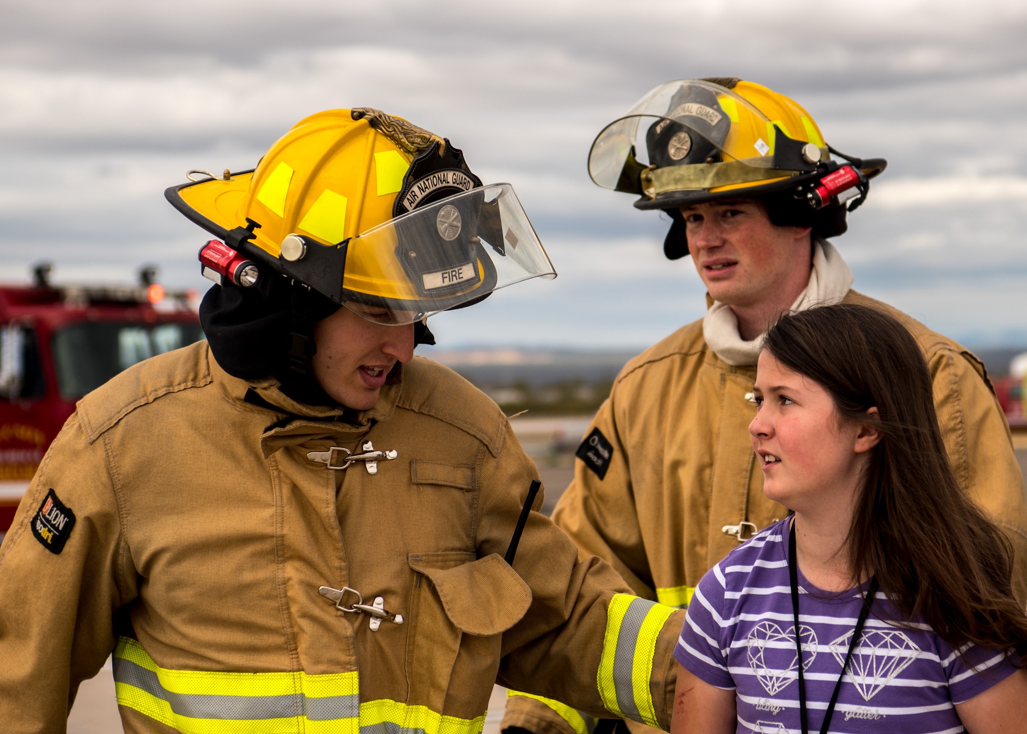 Staff Sgt. Jacob Stueben, left, and Staff Sgt. Killian Campbell, right, firefighters from the 162nd Wing Fire Department, Morris Air National Guard Base, assist an actor at the Tucson International Airport, Ariz., March 10, 2020. The Tucson Airport Authority regularly hosts a triennial exercise for local emergency services. (U.S. Air Force photo by Staff Sgt. Van Whatcott)