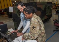 Photo of Spc. Jayla Sanders and Electronics Engineer Phu Nguyen