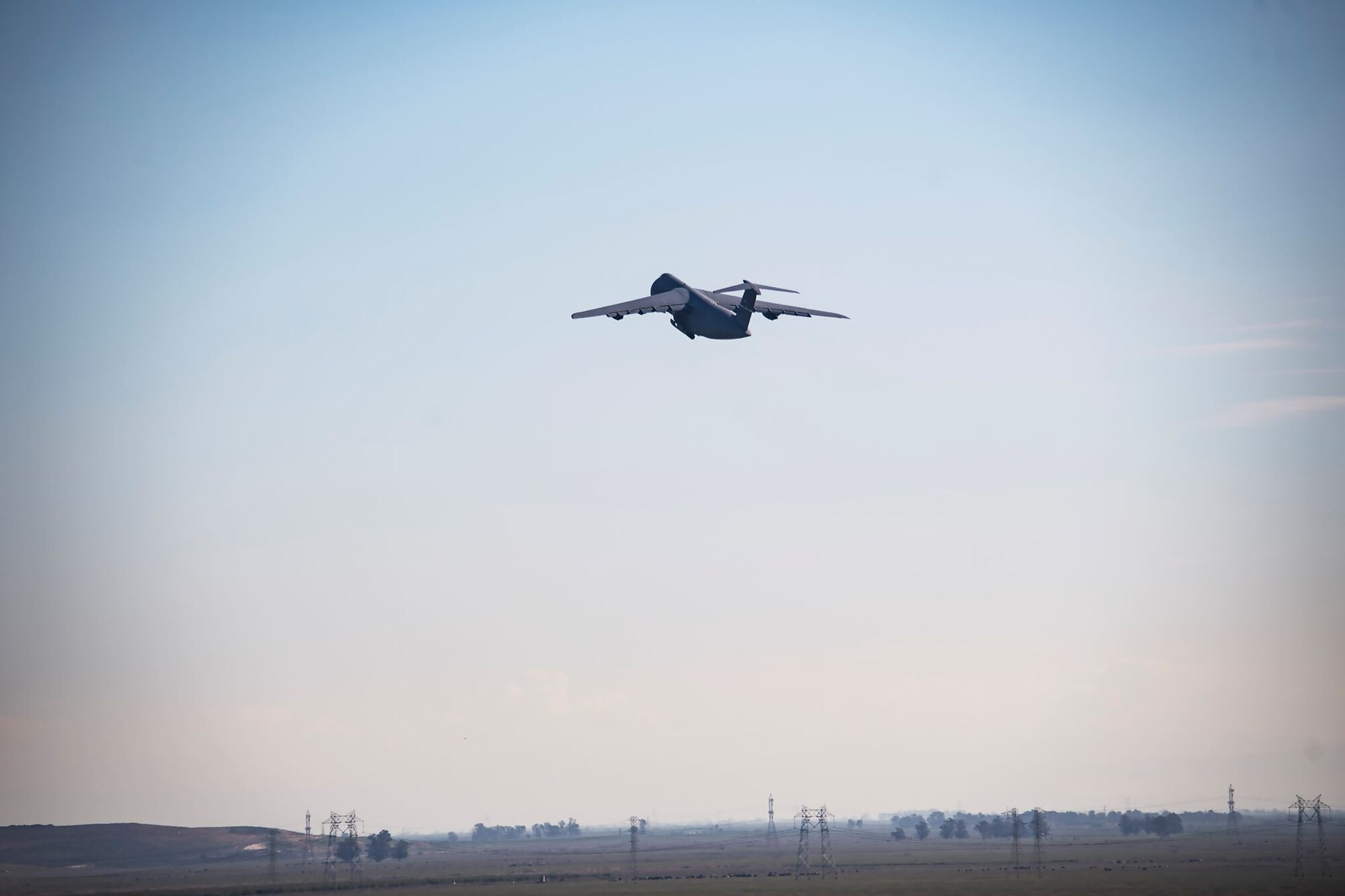 A U.S. Air Force C-5M Super Galaxy takes off during a flying mission March 11, 2020, at Travis Air Force Base, California. The C-5M is capable of reaching speeds of 579 mph and can carry over 250,000 pounds. (U.S. Air Force photo by Senior Airman Christian Conrad)