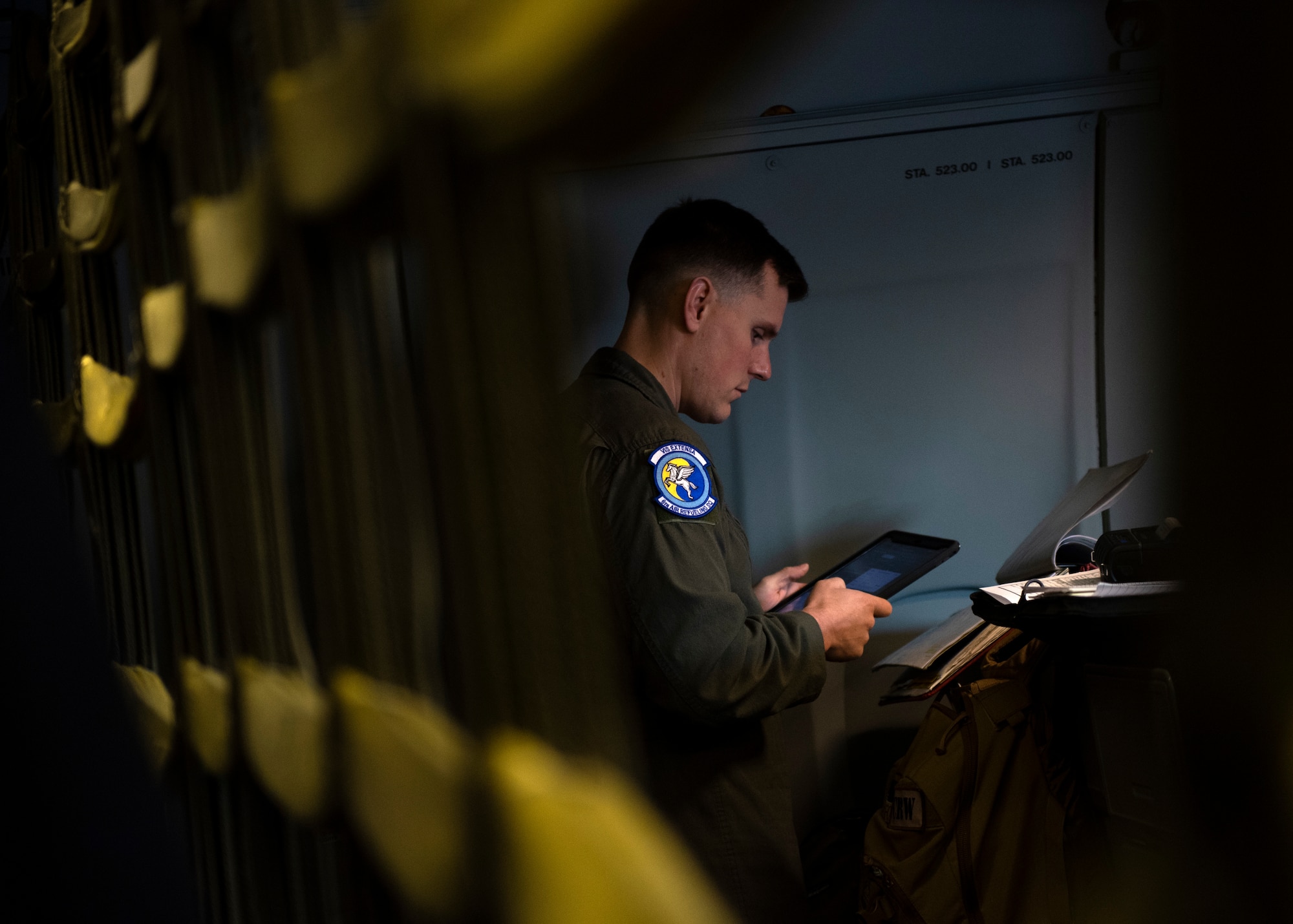 U.S. Air Force Staff Sgt. Cody Ivie, 6th Air Refueling Squadron boom operator, performs preflight checklist tasks on a KC-10 Extender at Travis Air Force Base, California, March 12, 2020. Boom operators are responsible for performing operational checks of air refueling and associated systems and equipment before every flight. (U.S. Air Force photo by Senior Airman Jonathon Carnell)