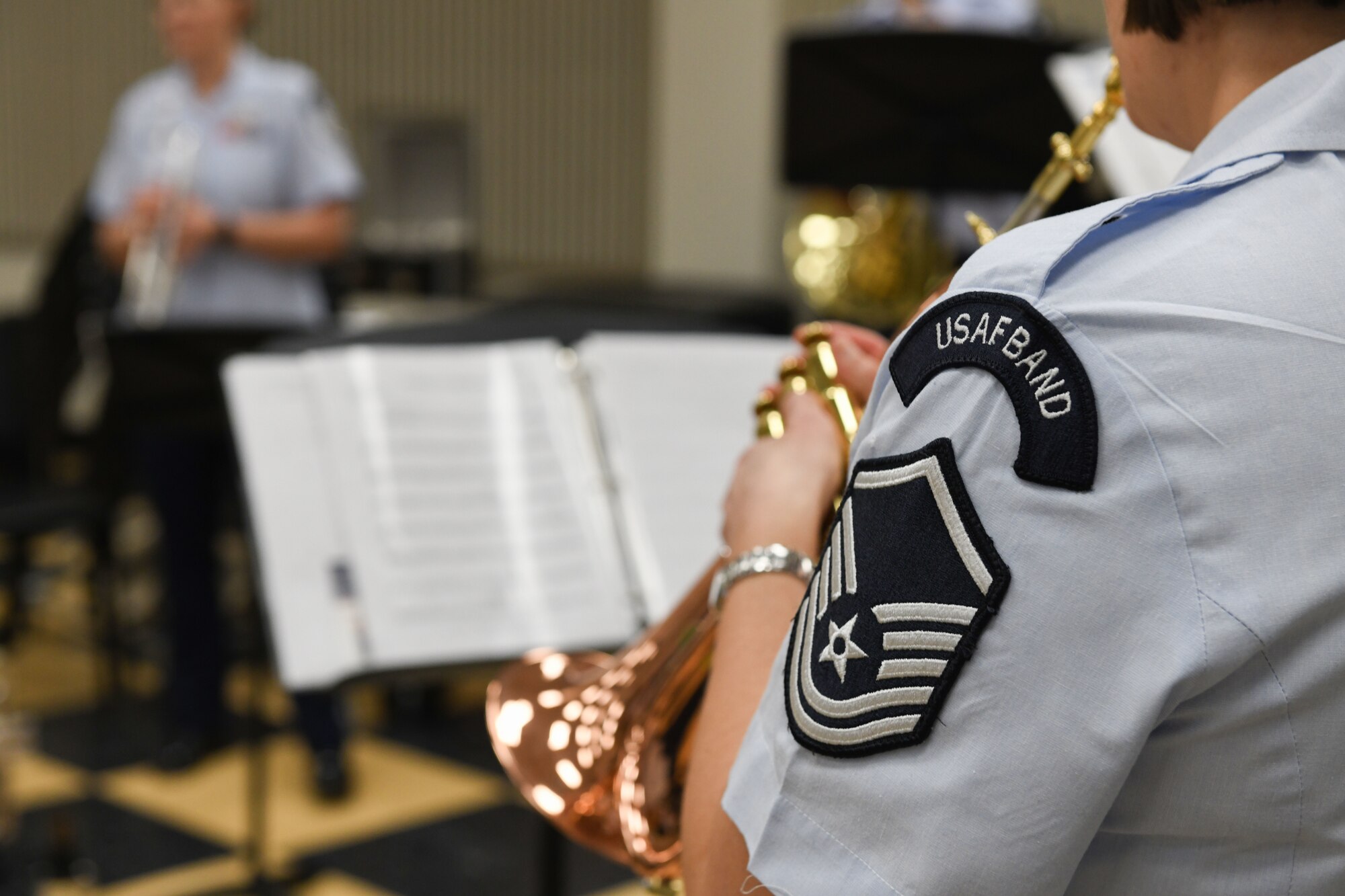 An Airman plays a trumpet