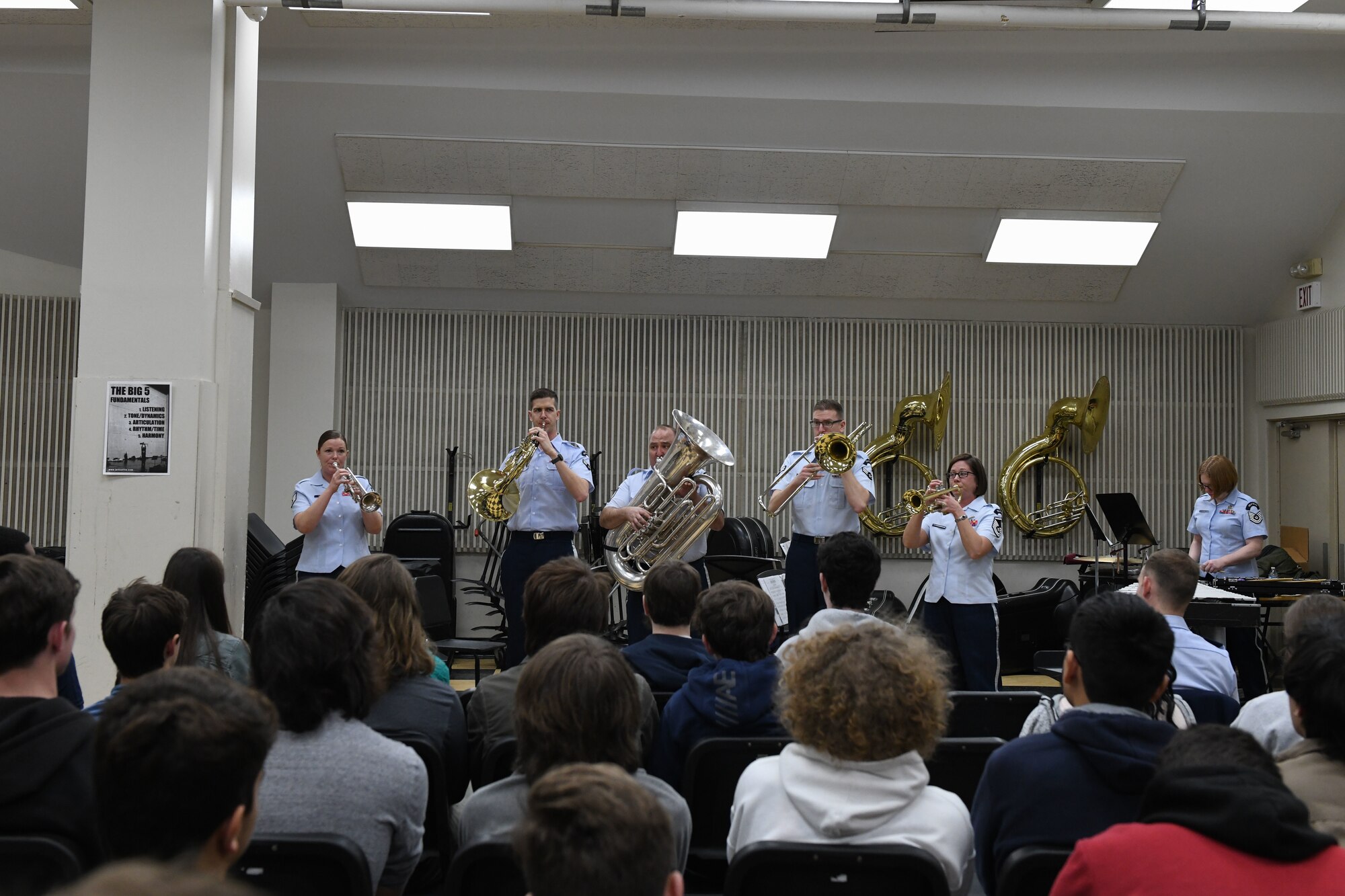 Band members play music for students