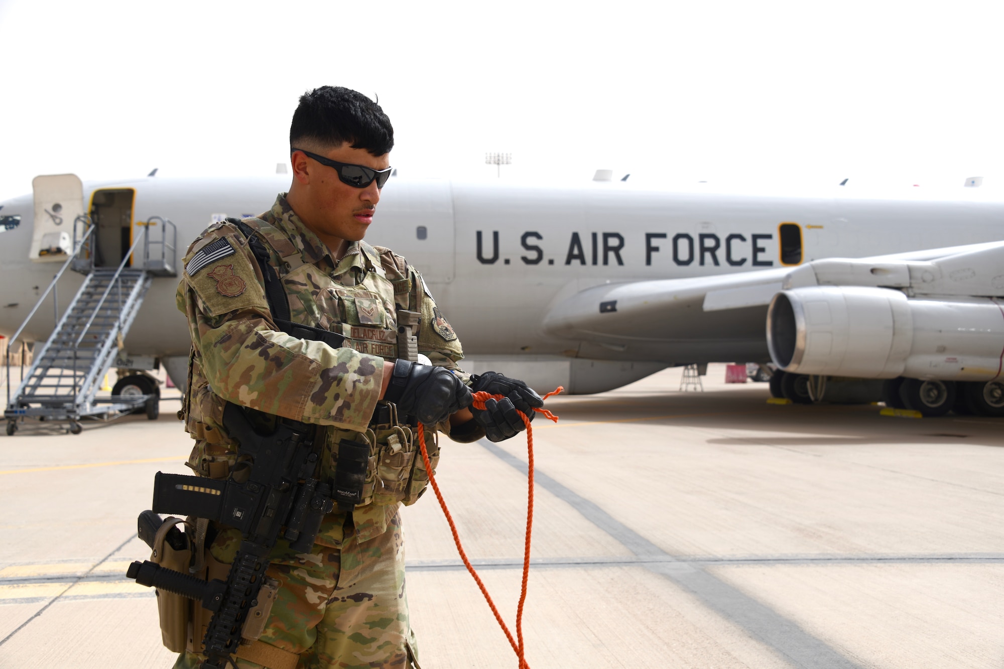 U.S. Air Force Airman 1st Class Christian Delacruz, 378th Expeditionary Security Forces Squadron defender, establishes a security perimeter around an E-8C Joint Surveillance Target Attack Radar System (JSTARS) at Prince Sultan Air Base, Kingdom of Saudi Arabia, March 8, 2020.