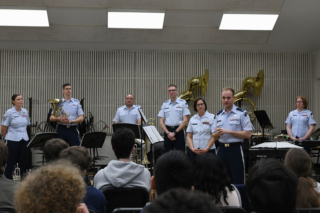 Airmen answer questions from band students