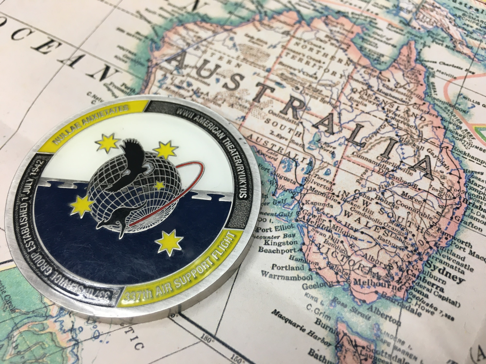 Photo of challenge coin on map