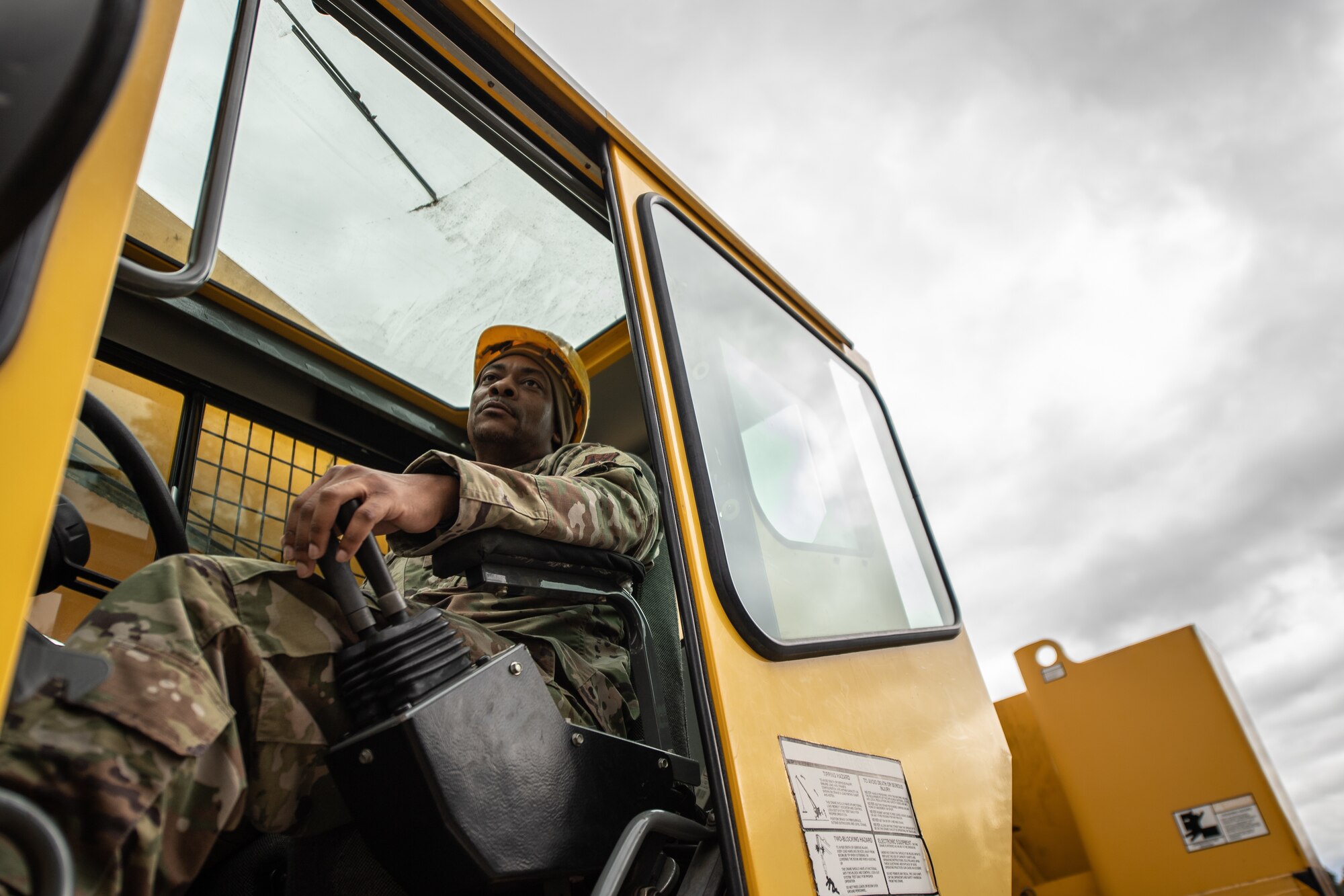 Photo of Airman operating a crane