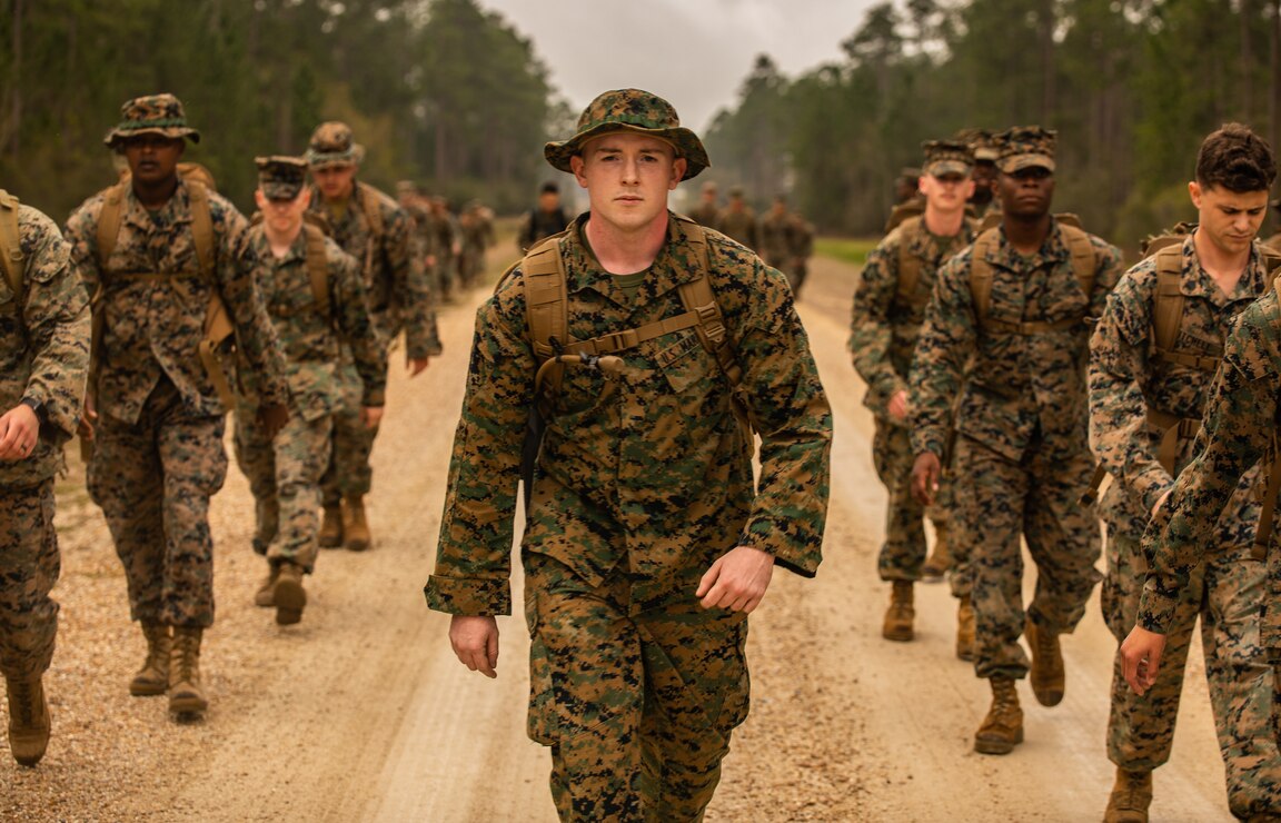 A U.S. Marine leads his squad to the first event during a field exercise, at Camp Villere, Slidell, La., March 11.