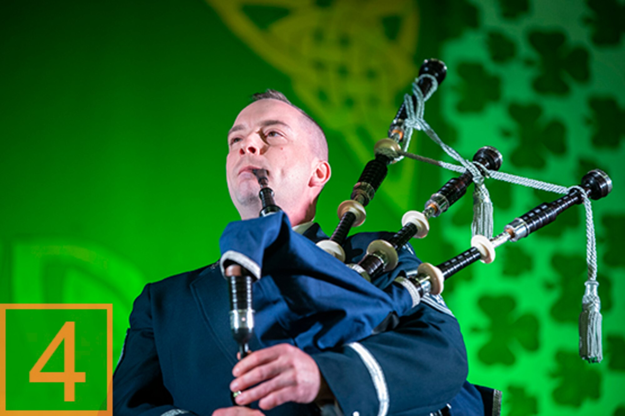 Photo of a man playing the bagpipes