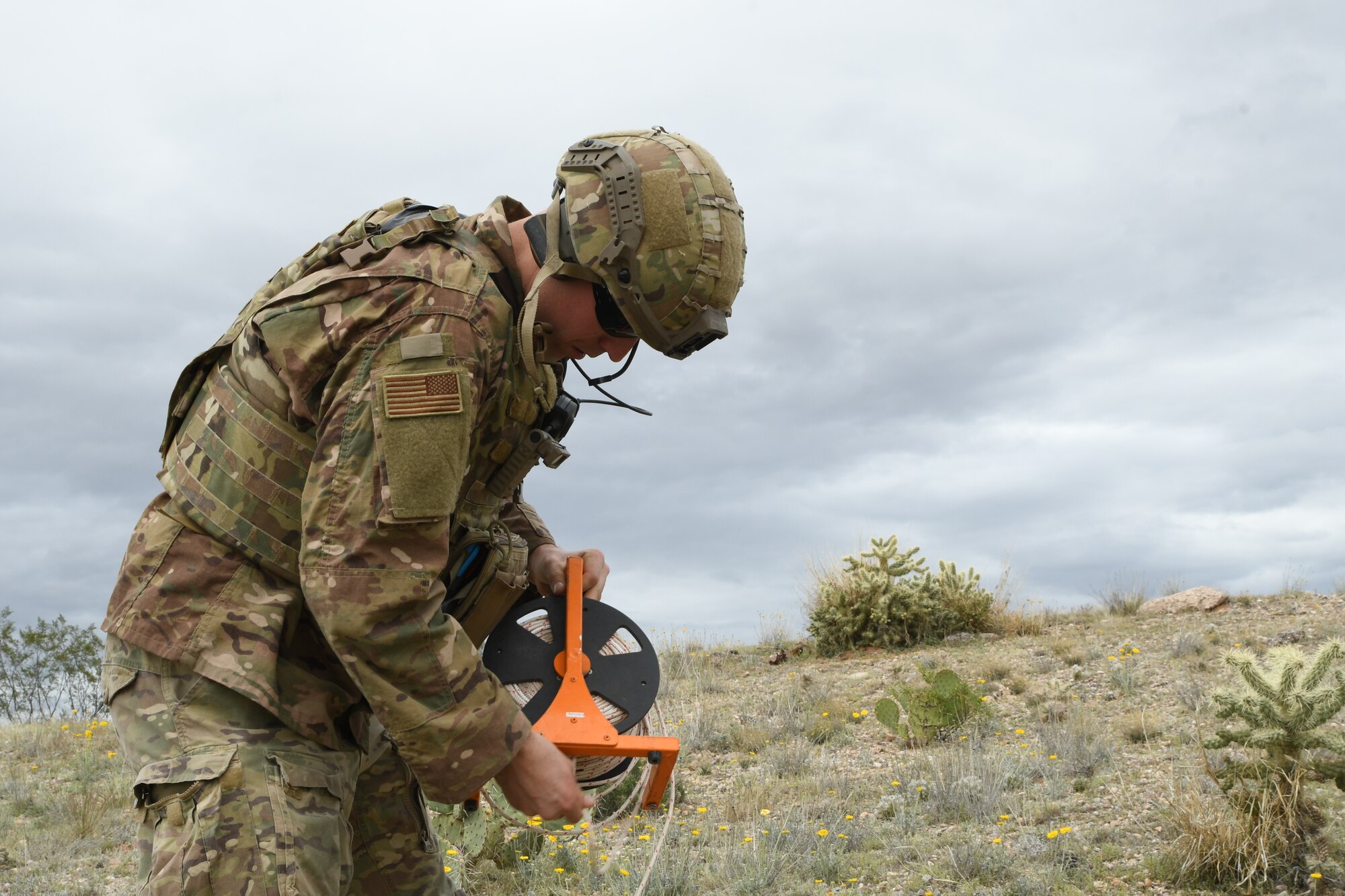 A photo of an airman drawing rope