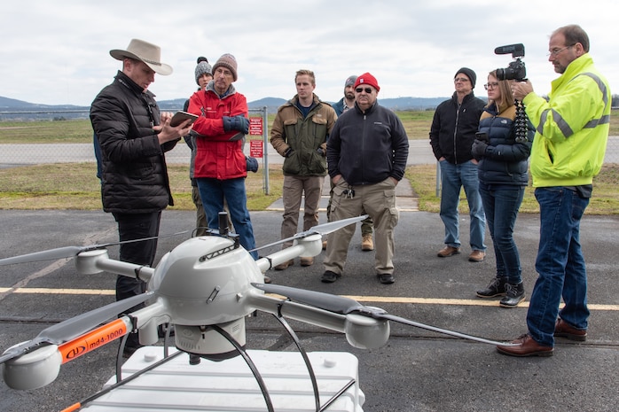 Navigational Electronics Inc. demonstrator and subject-matter expert Ross Kenney explains features of the Microdrones MD4-1000 unmanned aircraft system controller to members of the U.S. Army Engineering and Support Center, Huntsville, during a capabilities review at the Rocket City Radio Controllers complex in southeast Huntsville, Alabama, Feb. 27, 2020.