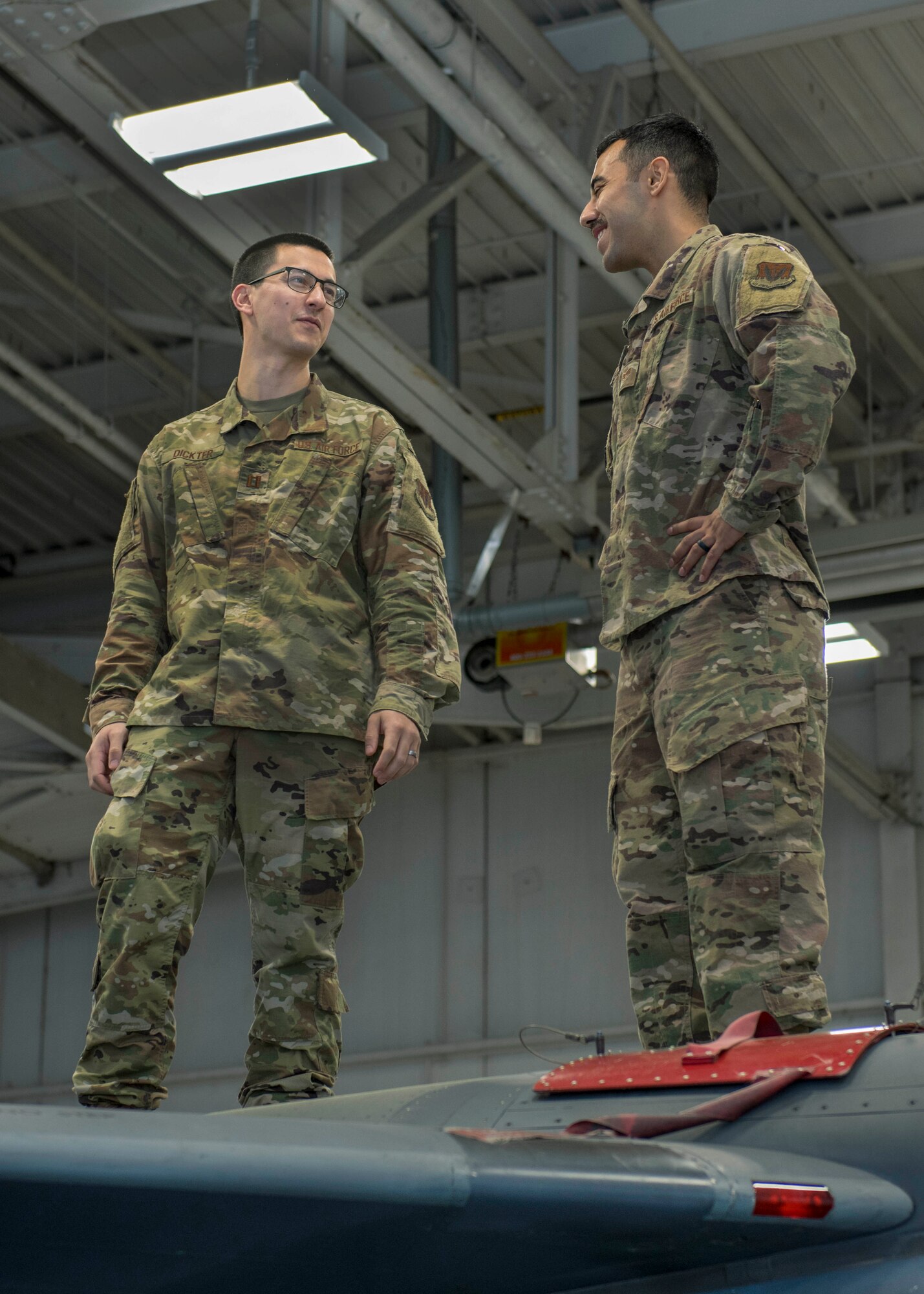 Capt. Benjamin Dickter, 4th Operations Medical Readiness Squadron mental health clinic officer in charge clinical psychologist, and Sgt. George Lopez, 4th Maintenance Group aircraft maintenance qualification program instructor, stand on top of an F-15E Strike Eagle, March 11, 2020, at Seymour Johnson Air Force Base, N.C