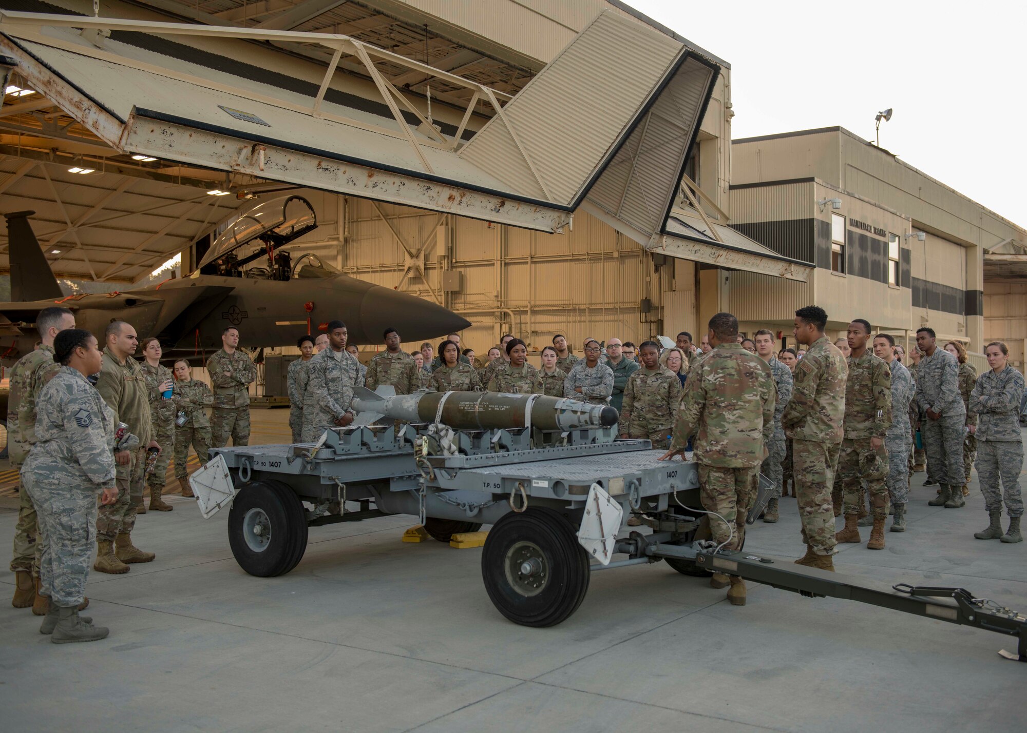 Airmen from the 4th Maintenance Group teach Airmen from the 4th Operations Medical Readiness Squadron about the type of munitions that can be mounted on an F-15E Strike Eagle, March 11, 2020, at Seymour Johnson Air Force Base, N.C.