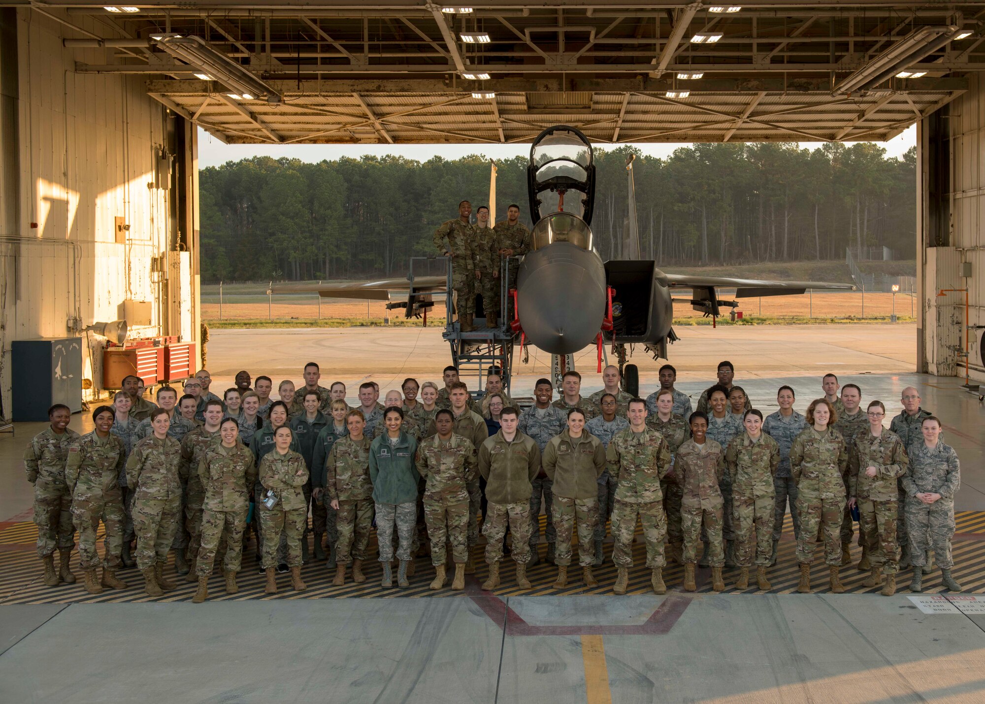 Airmen from the 4th Operations Medical Readiness Squadron pose for a photo in front of an F-15E Strike Eagle, March 11, 2020, at Seymour Johnson Air Force Base, N.C.