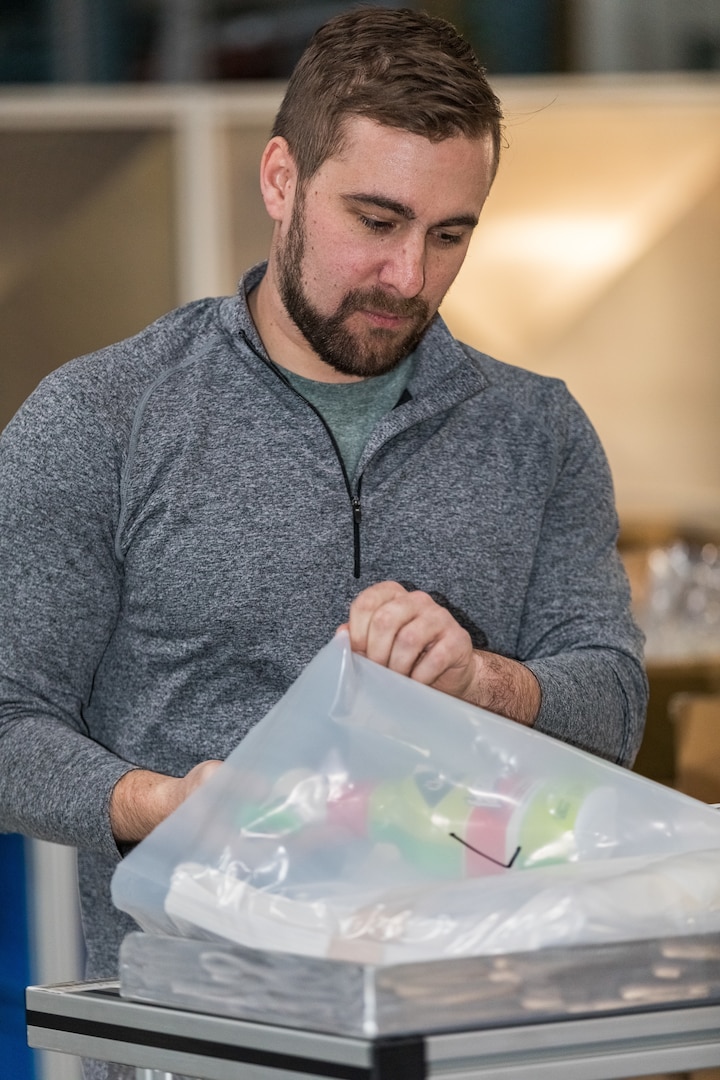 Klint Kirkpatrick, a general foreman with Shop 06, tooling and logistics, assembles a cleaning kit at Puget Sound Naval Shipyard & Intermediate Maintenance Facility. Employees from Puget Sound Naval Shipyard & Intermediate Maintenance Facility worked throughout the weekend to put together more than 2,000 cleaning kits to use around the command in an effort to amplify sanitation efforts during the COVID-19 pandemic.