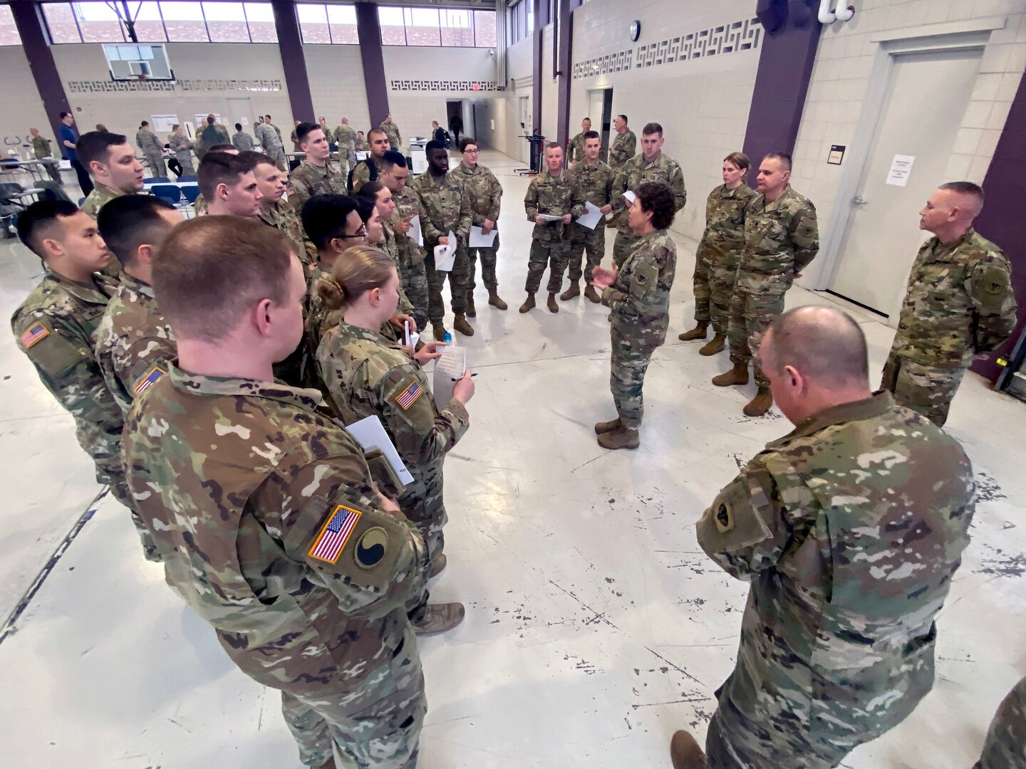 Brig. Gen. Joane Mathews, Wisconsin's deputy adjutant general for Army, speaks March 12, 2020, to troops mobilizing for state active duty in response to the Wisconsin Department of Health Service's request for assistance. The troops transported 29 Wisconsin citizens who had been aboard the Grand Princess cruise ship with confirmed cases of COVID-19 to their homes for self-quarantine after they arrived March 15.