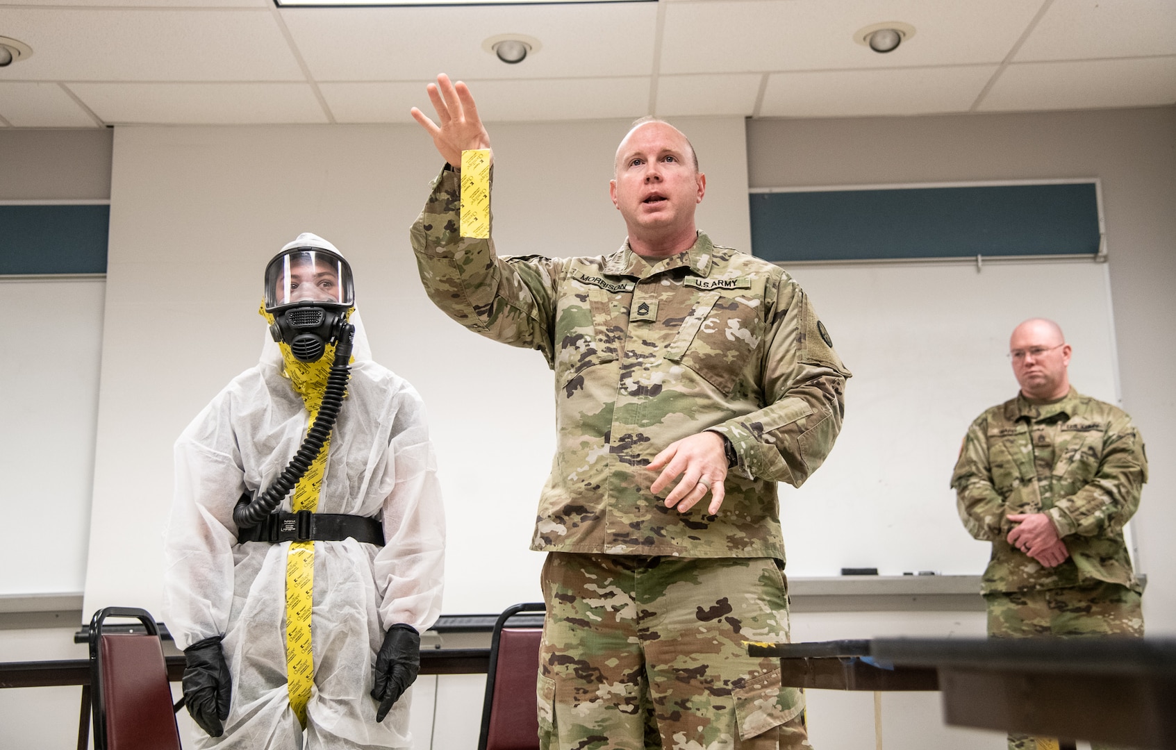 Photo caption for attached images: Members of the West Virginia National Guard's (WVNG) Chemical, Biological, Radiological, Nuclear and High Yield Explosive (CBRNE) Battalion, 35th Civil Support Team (CST) and the 35th CBRN Enhanced Response Force Package (CERFP) provide hands-on personal protective equipment (PPE) instruction to members of first responder agencies from Kentucky and West Virginia, March 16, 2020, in Huntington, W.Va. The just-in-time training was conducted in order to educate first responders on how to minimize cross-contamination through the proper wear of, “donning” and the procedures for “doffing” PPE. (U.S. Army National Guard photo by Edwin L. Wriston)