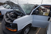 Navy Senior Chief Intelligence Specialist Damon Cable, assigned to the Joint Task Force Civil Support (JTF-CS) security department, performs a weekly maintenance check on one of the command’s deployable vehicles.