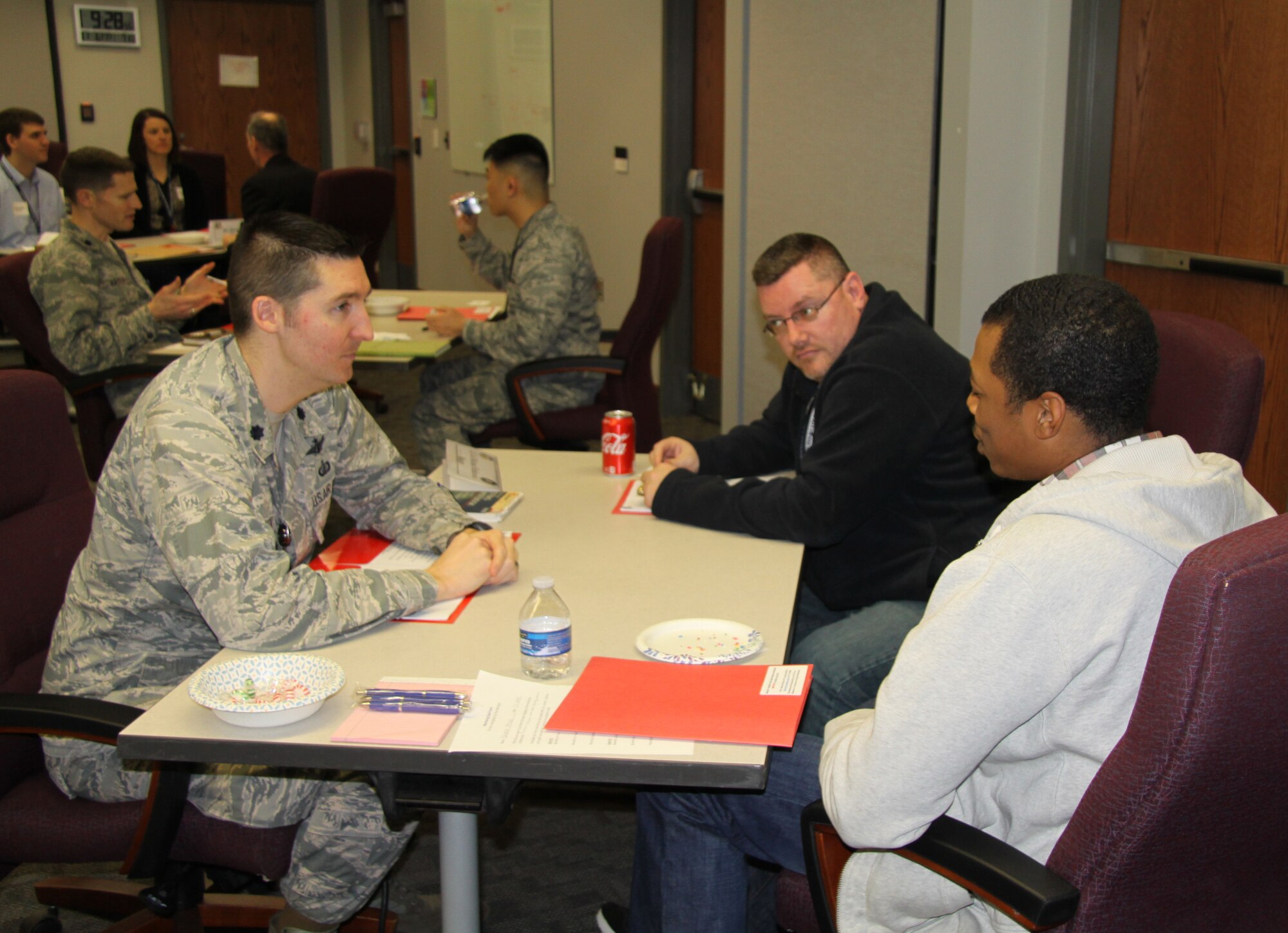 The Air Force Research Laboratory Sensors Directorate kicked off the Wright Connections Mentoring Program provided by the Sensors Directorate Learning office March 6. At the opening event, held at the Sensors Directorate Globalhawk Conference Room, mentors were matched with mentees and had the opportunity to learn a little bit about one another. Mentor Lt. Col. Michael Hethcock, Sensors Advanced Programs Branch Chief (left), and mentees Joseph Drake, and Brooklyn Bradley (right). (U.S. Air Force photo/Ted Pitts.)