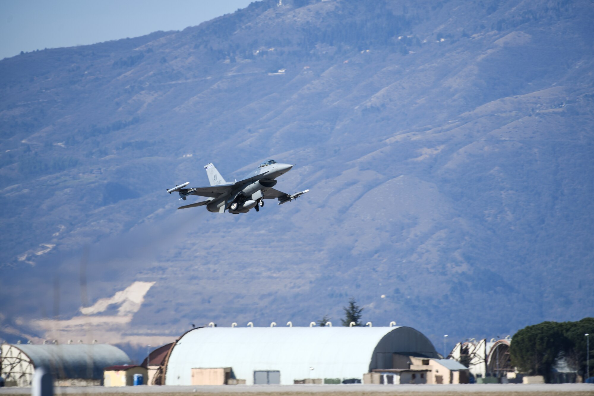 A U.S. Air Force F-16 Fighting Falcon from the 510th Fighter Squadron takes off at Aviano Air Base, Italy, March 16, 2020. The 510th FS provides combat airpower on demand to U.S. and NATO combatant commanders as well as the National Command Authority in order to meet National Security objectives.(U.S. Air Force photo by Airman 1st Class Ericka A. Woolever)
