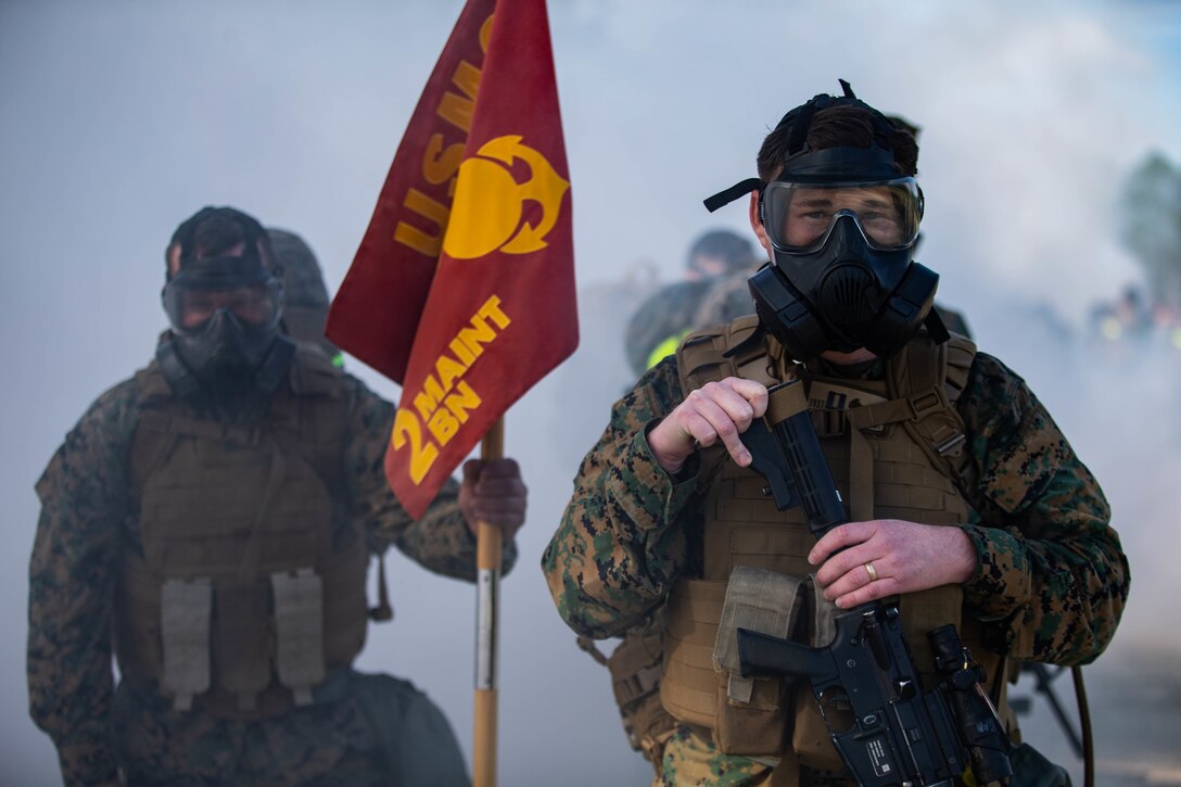 U.S. Marines with 2nd Maintenance Battalion, 2nd Marine Logistics Group, conduct chemical biological radiological nuclear training during a hike on Camp Lejeune, N.C., March, 11, 2020. 2nd Maintenance Battalion held a hike in observance of the 75th anniversary of the battle of Iwo Jima. (U.S. Marine Corps photo by Lance Cpl. Scott Jenkins)