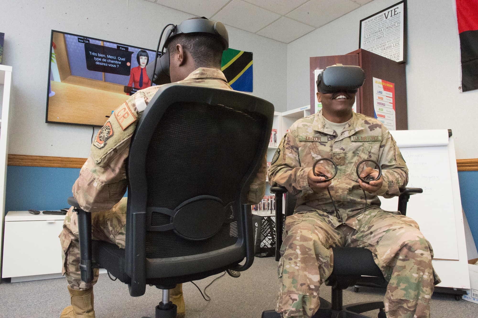 Airman 1st Class Etchy Tambe (left) and Senior Airman Trevaughn Taylor (right), 621st Contingency Response Squadron aerial porter journeymen, test out the French language virtual reality programs at the Language Learning Center at Joint Base McGuire-Dix-Lakehurst, New Jersey, Mar. 3, 2019. The LLC was created to help Airmen from the 818th Mobility Support Advisory Squadron maintain French language proficiency for their frequent trips to Africa in support of developing air mobility capabilities. (U.S. Air Force photo by Staff Sgt. Sarah Brice)