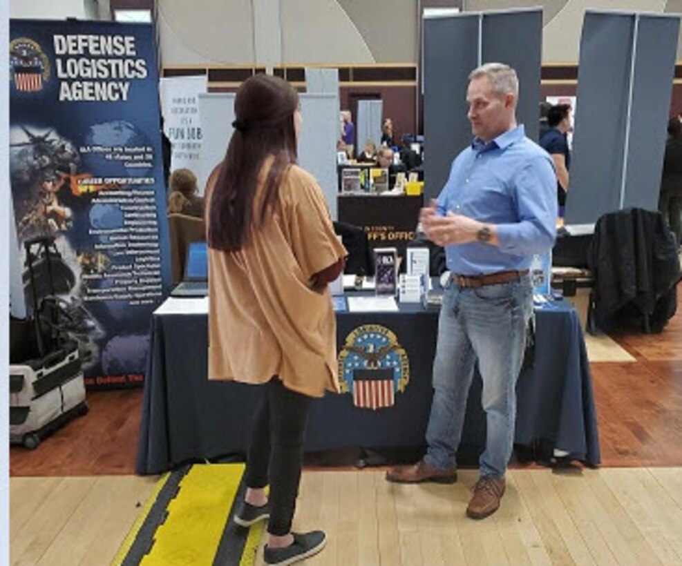 DLA Land and Maritime recruiter answers questions for an OSU student at the 2020 Summer Career and Internship Fair.