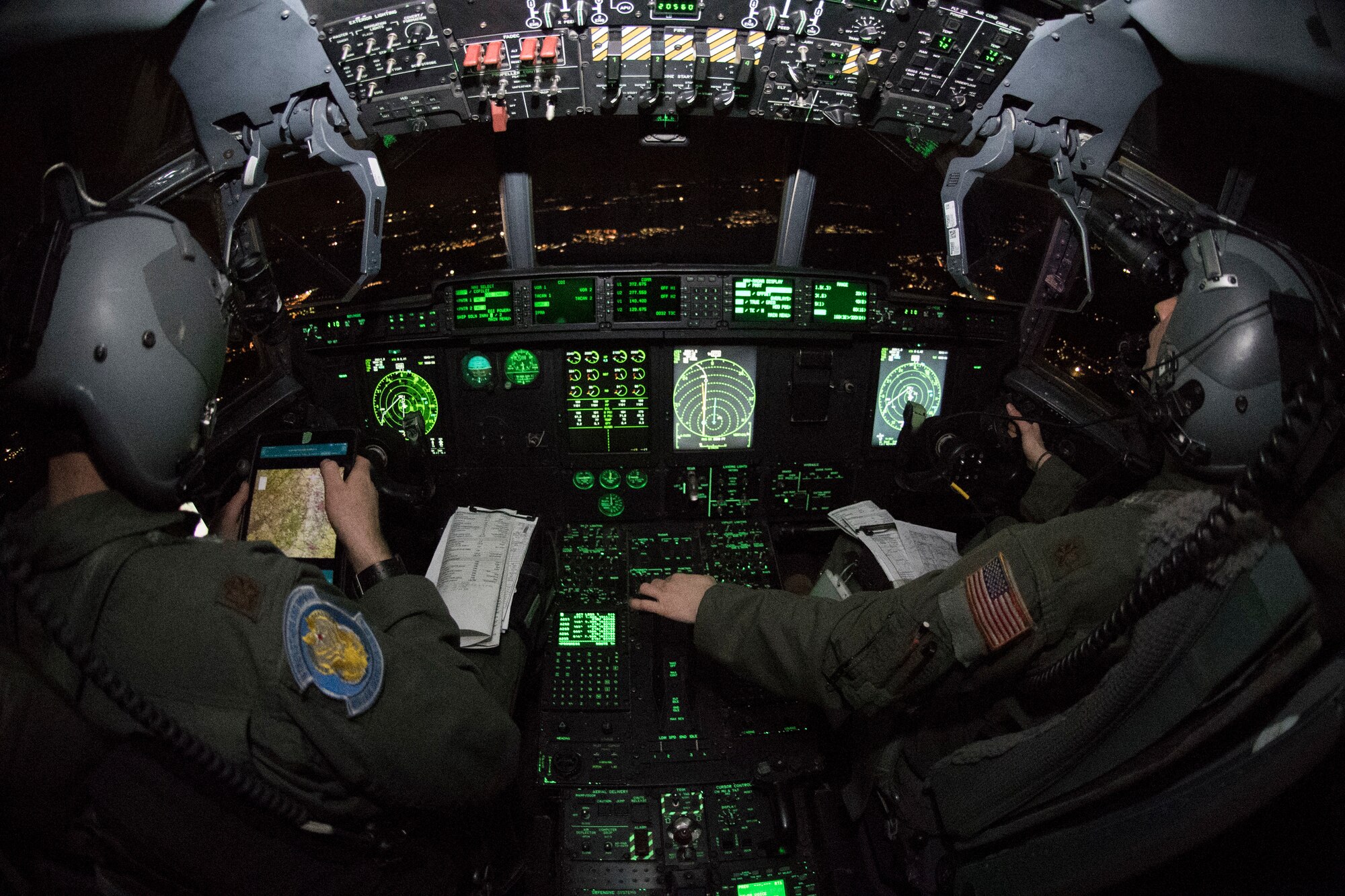 U.S. Air Force Maj. Mary Baldwinand Maj. Benn Slikker, 37th Airlift Squadron C-130J Super Hercules aircraft pilots, fly over Germany.
