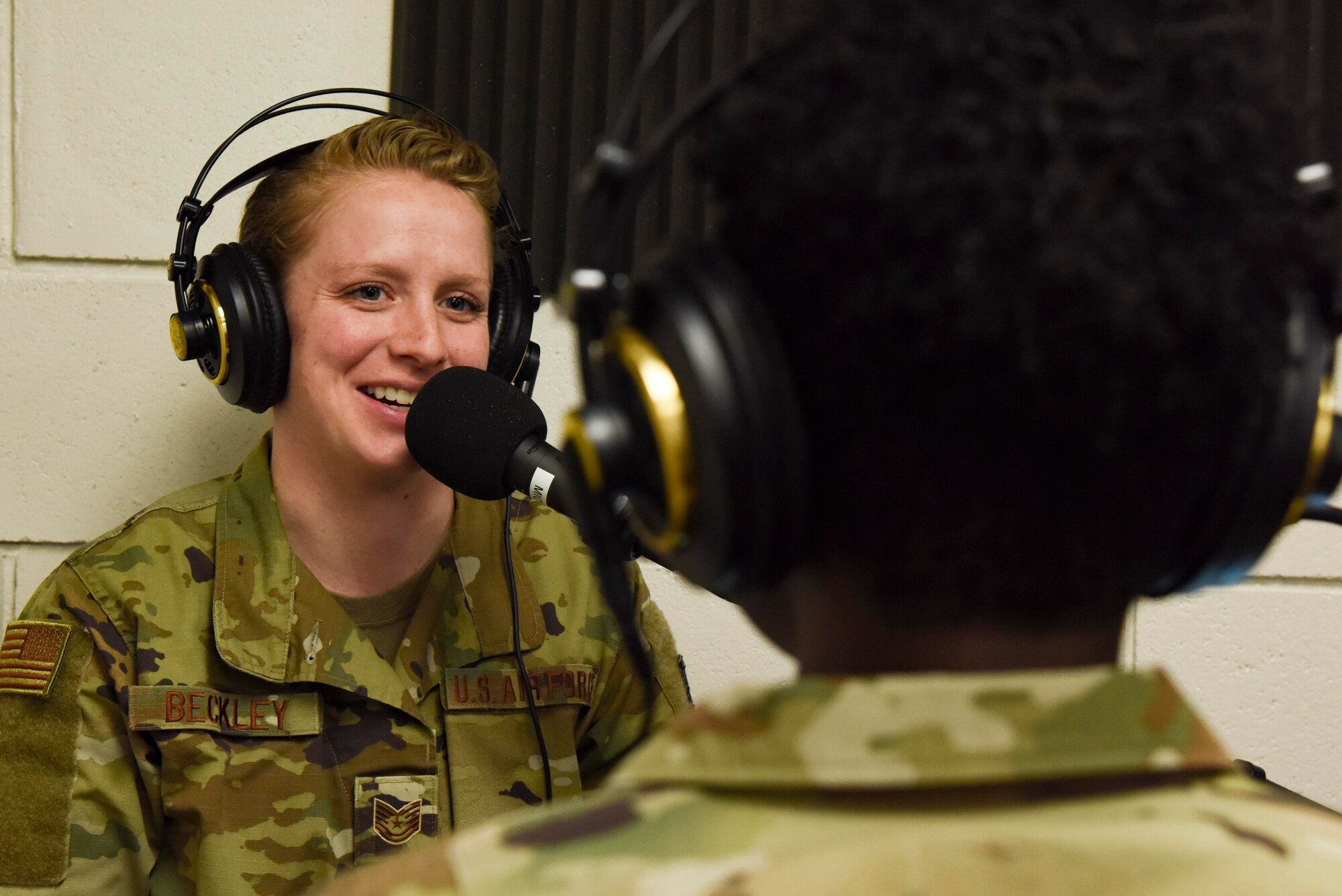 Tech. Sgt. Laura Beckley, 436th Airlift Wing broadcast journalist, speaks with Col. Angenene Robertson, Air Mobility Command director of manpower, personnel and services, during a Bedrock Podcast March 12, 2020, at Dover Air Force Base, Delaware. Robertson visited the base for a Dover AFB force support immersion where she learned in-depth details about each organization’s mission and day-to-day operations, including the Air Force Mortuary Affairs Operations. (U.S. Air Force photo by Senior Airman Eric M. Fisher)