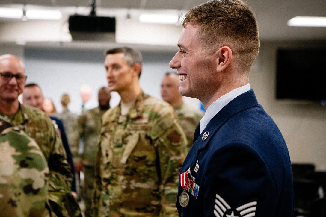 Staff Sgt. Benjamin Anderson, an air freight journeyman assigned to the 137th Special Operations Logistics Readiness Squadron, shakes hands and thanks attendees in a receiving line, during an Oklahoma Star of Valor ceremony March 7, 2020, at Will Rogers Air National Guard Base, Oklahoma City. Guests had the opportunity to hear Anderson’s firsthand account of his heroic actions which saved a life on April 29, 2018.