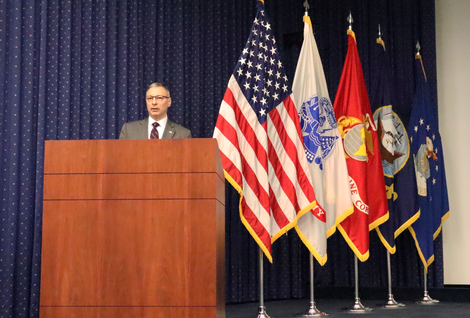 man behind podium