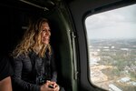 Rosalie Simcoe, with Cisco, smiles as she looks out the window during a ride in a Black Hawk helicopter during a Bosslift event sponsored by the North Carolina Employer Support of the Guard and Reserve at North Carolina National Guard’s (NCNG) Army Aviation Support Facility in Morrisville, N.C. March 10, 2020. The events give employers a better understanding of what their employees do when they have to take off work to fulfill their National Guard commitments.