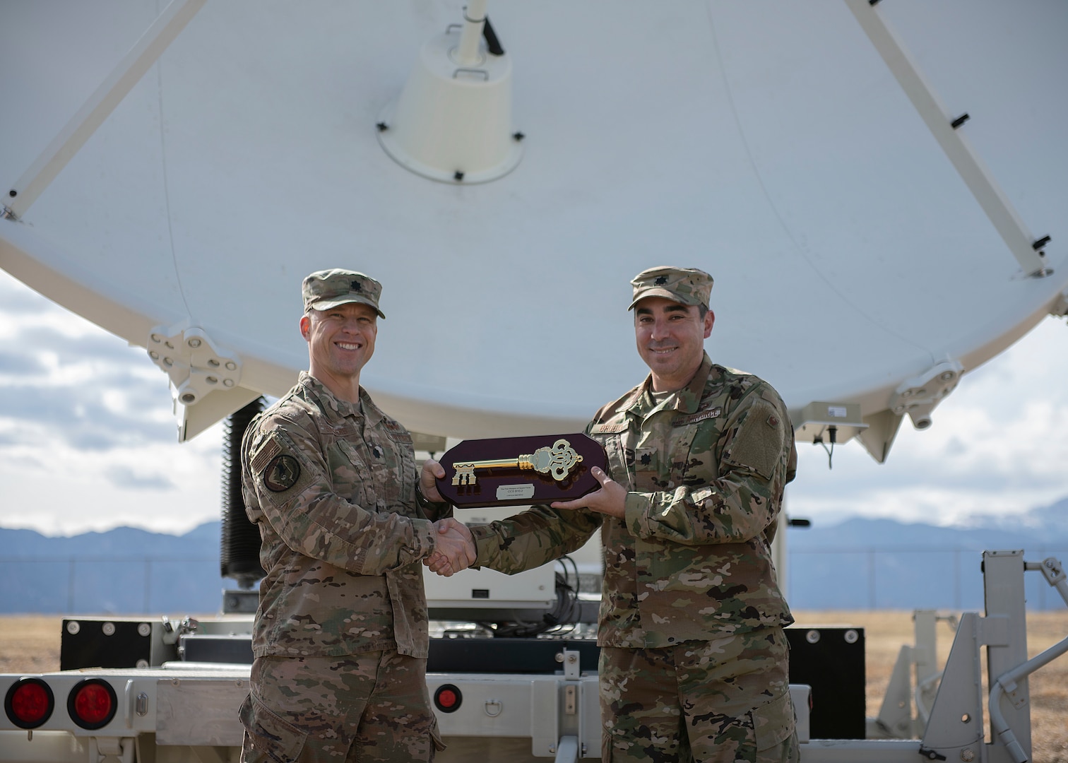 Lt. Col William Sanders, left, 4th Space Control Squadron commander, receives the Counter Communications System Block 10.2 from Lt. Col. Stephen Brogan, right, combat systems branch materiel leader at the Space and Missile Systems Center at Los Angeles Air Force Base, Calif., March 12 on Peterson Air Force Base, Colo. Once handed over, the B10.2 became the first offensive weapon system assigned to the United States Space Force.