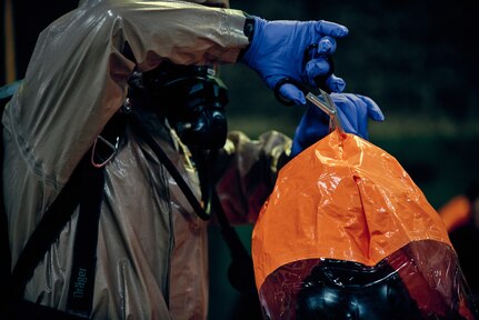 Airmen and Soldiers of the 2nd Civil Support Team, New York National Guard based at Stratton Air National Guard Base, Schenectady, N.Y., decontaminate themselves after searching a six-story warehouse for weapons of mass destruction during a training exercise in Amsterdam, N.Y., Feb. 25, 2020. The training prepares the Guard members for certification required every 18 months.