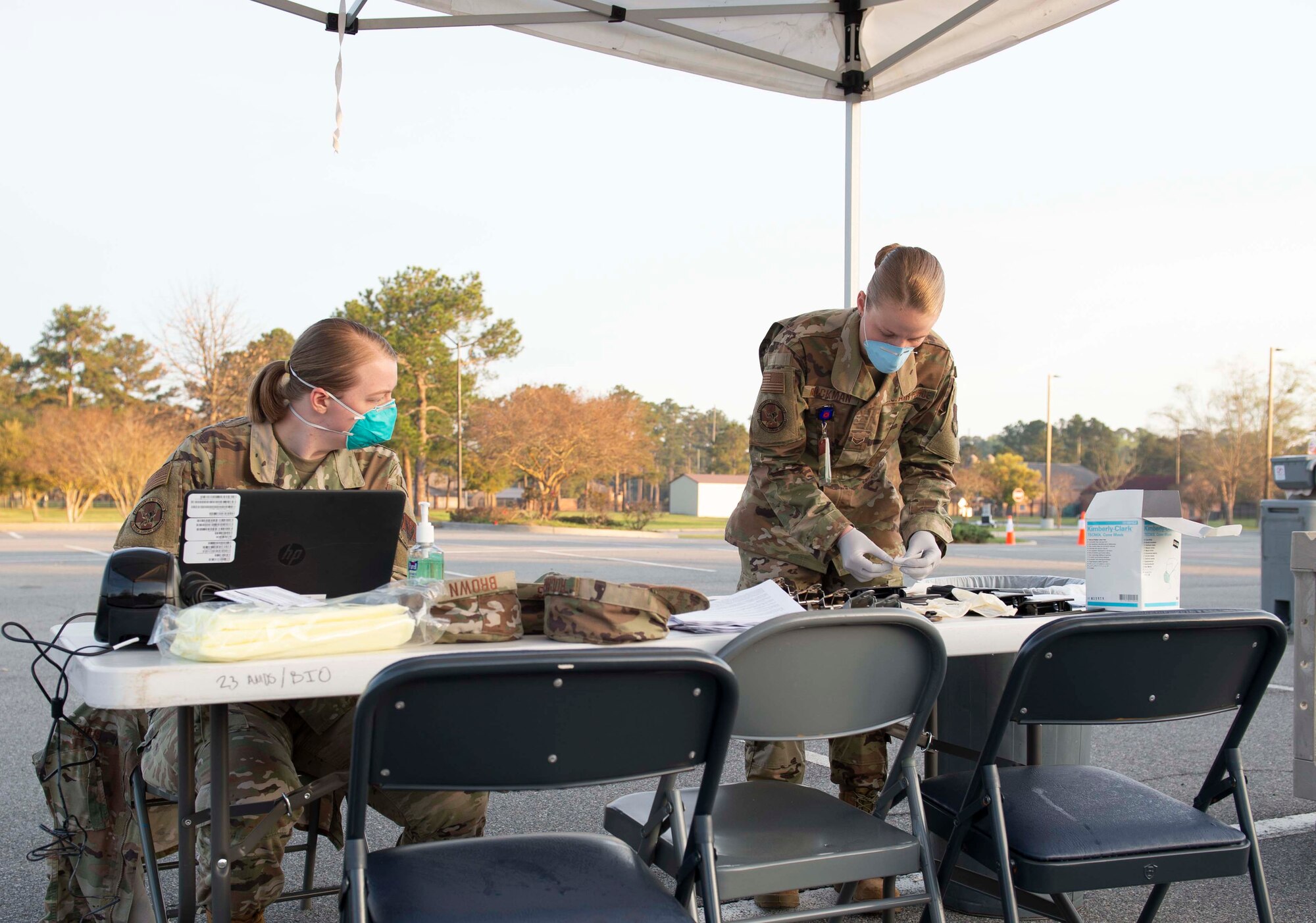 Photo of Airmen preparing for a drive-through health screening.