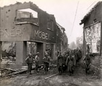 Some 117th Infantry Regiment, 30th Infantry Division and 2nd Armored Division Soldiers with captured German troops near the Siegfried Line - Palenburg, Germany, October 1944.