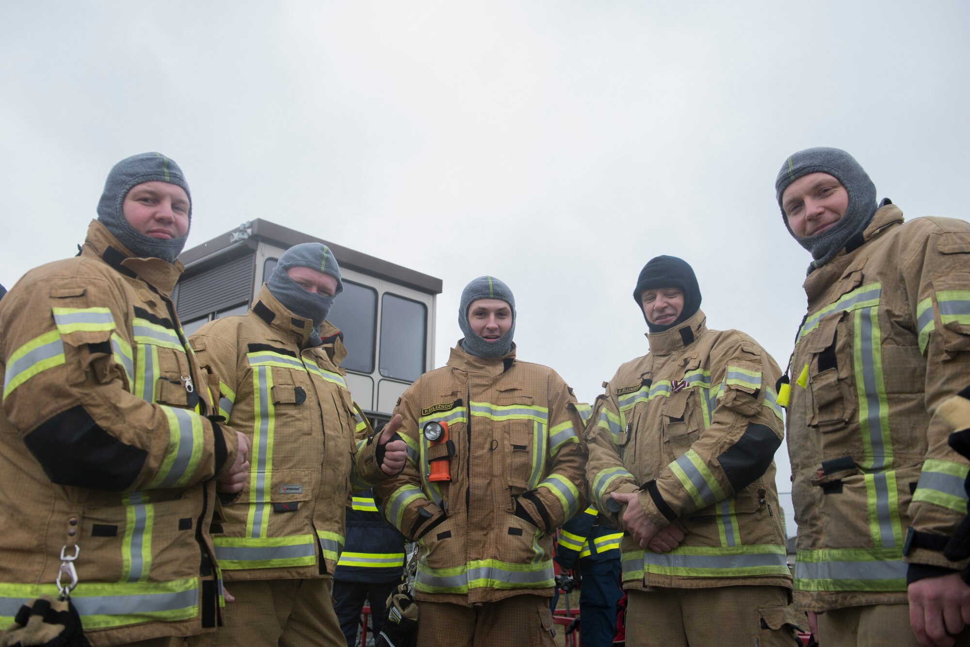 Photo of firefighters posing for a photo.